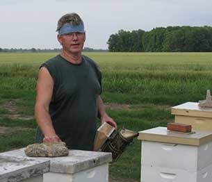Founder Tim Durham Sr. at his beehives